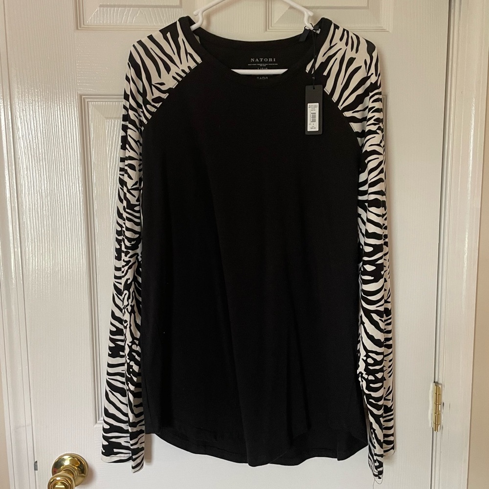Awesome shirt! Zebra print on sleeves. Medium-large nwt